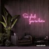 So Glad You Are Here neon sign in baby pink for entryways, restaurant walls, and welcoming interiors.