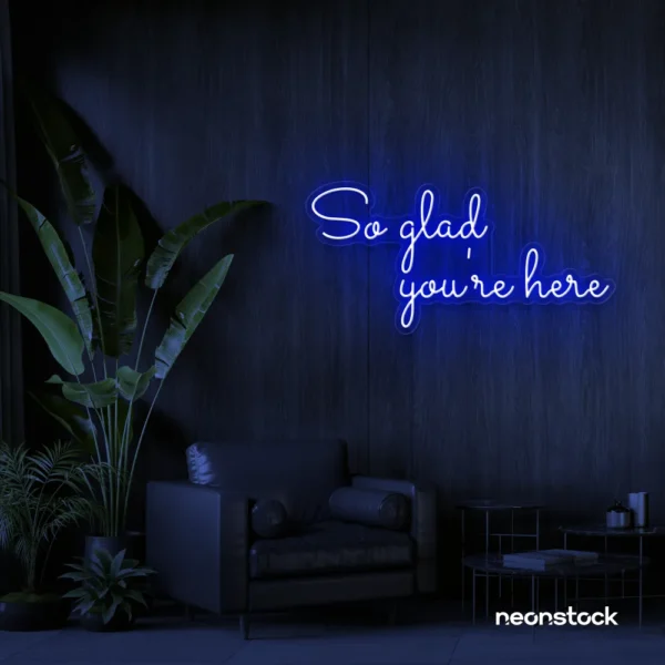 So Glad You Are Here neon sign in dark blue for entryways, restaurant walls, and welcoming interiors.