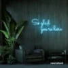 So Glad You Are Here neon sign in ice blue for entryways, restaurant walls, and welcoming interiors.