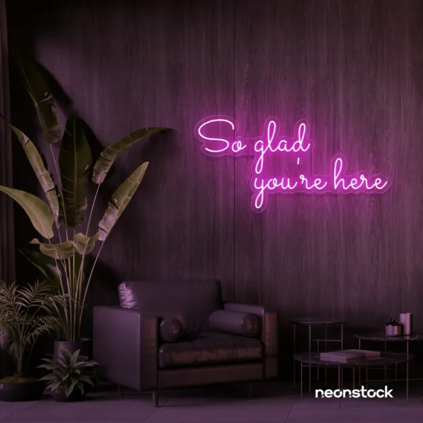 So Glad You Are Here neon sign in pink for entryways, restaurant walls, and welcoming interiors.