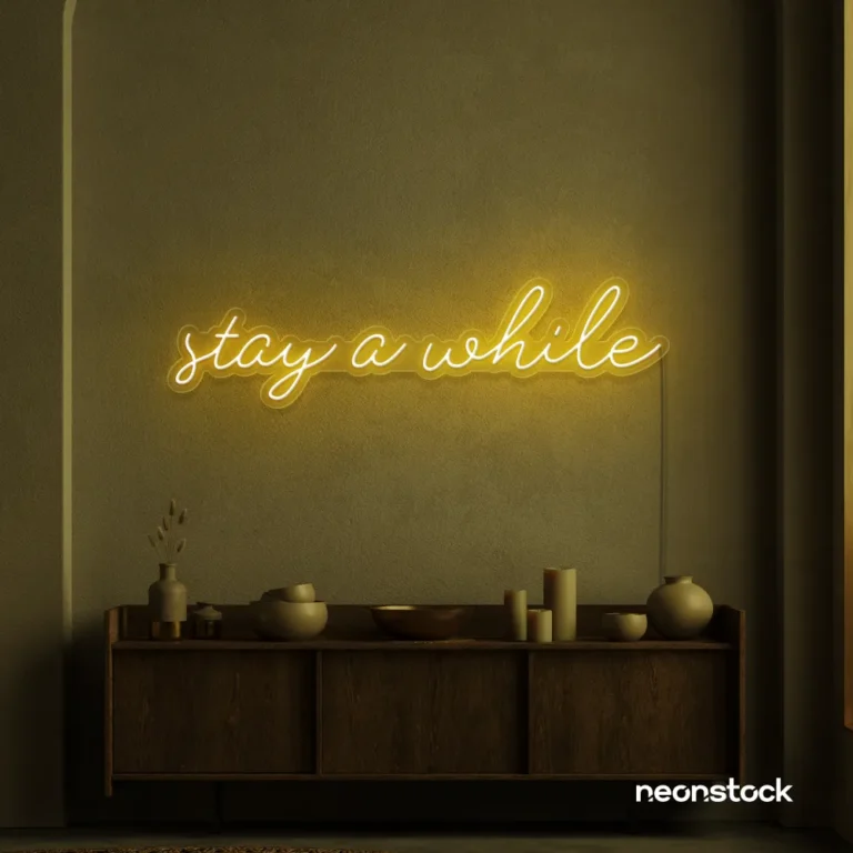 Stay Awhile neon sign in golden yellow for cozy cafes, home decor, and hospitality settings.