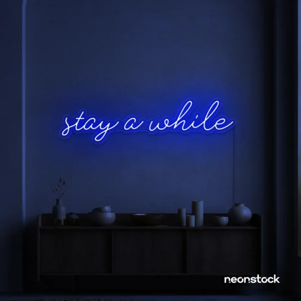Stay Awhile neon sign in dark blue for cozy cafes, home decor, and hospitality settings.