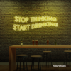 Stop Thinking Start Drinking neon sign in lemon yellow for bar walls, man caves, and party spaces.