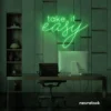 Take It Easy neon sign in green for chill wall decor, boho rooms, and relaxed interiors.
