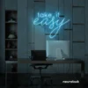 Take It Easy neon sign in ice blue for chill wall decor, boho rooms, and relaxed interiors.