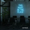 This Must Be The Place neon sign in ice blue for cozy salons, boutique shops, and cafe decor.