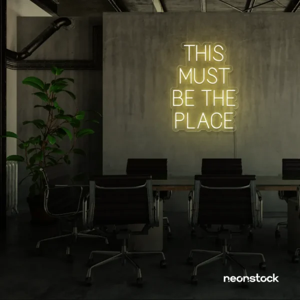 This Must Be The Place neon sign in warm white for cozy salons, boutique shops, and cafe decor.