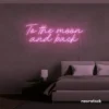 To the Moon and Back neon sign in baby pink for nursery rooms, kids' spaces, and bedtime wall decor.