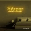 To the Moon and Back neon sign in golden yellow for nursery rooms, kids' spaces, and bedtime wall decor.