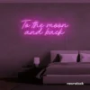 To the Moon and Back neon sign in pink for nursery rooms, kids' spaces, and bedtime wall decor.