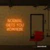 Normal Gets You Nowhere neon sign in orange for bold interiors, creative offices, and motivational decor.