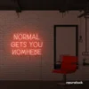 Normal Gets You Nowhere neon sign in peachy pink for bold interiors, creative offices, and motivational decor.