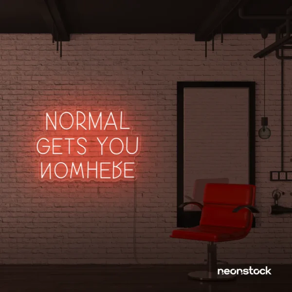 Normal Gets You Nowhere neon sign in peachy pink for bold interiors, creative offices, and motivational decor.