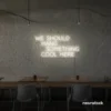 Neon sign text 'We should hang something cool here' in Neutral white for wall art and home decor