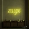 You Are Enough neon sign in lemon yellow for self-love decor, therapy rooms, and calm spaces.