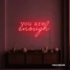 You Are Enough neon sign in red for self-love decor, therapy rooms, and calm spaces.