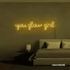 You Glow Girl neon sign in warm white for dorm rooms, vanity walls, and beauty studio decor.